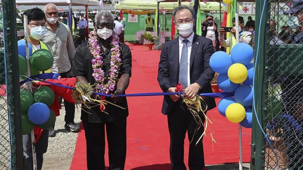 Solomons PM Manasseh Sogavare (left) and China's ambassador to the Solomon Islands Li Ming during the opening ceremony of a China-funded stadium complex in Honiara. Picture: Chinese Embassy of Solomon Islands