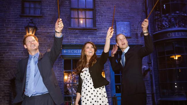 Catherine, Duchess of Cambridge, with Prince Harry and Prince William, wearing a $68 polka dot dress from Top Shop in 2013. Picture: Paul Rogers/Getty Images