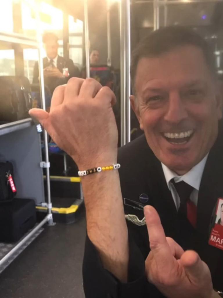 An Qantas crew man was given a friendship bracelet from a passenger. Picture: TikTok