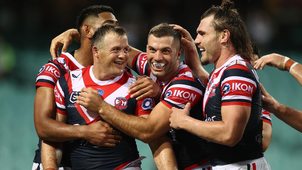 Josh Morris celebrates with his Roosters teammates after scoring one of his 157 NRL tries.