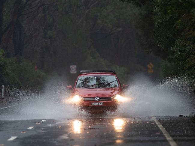 Cars regularly have to drive through flooded sections of Wakehurst Parkway. The council has voted to start work to reduce flooding on the stretch between Oxford Falls and Narrabeen. Picture: Julian Andrews