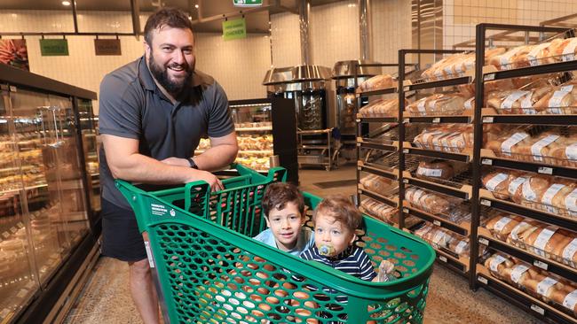 Brett Campbell and his sons Jack Campbell, 4, and Luke Campbell, 2, do their weekly shop in the fresh bakery section. Picture: Brendan Radke