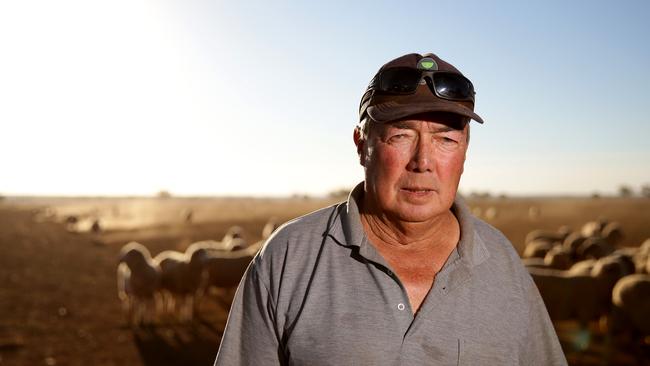 Paul Guy at Tullamore after feeding his sheep. Picture: Jonathan Ng