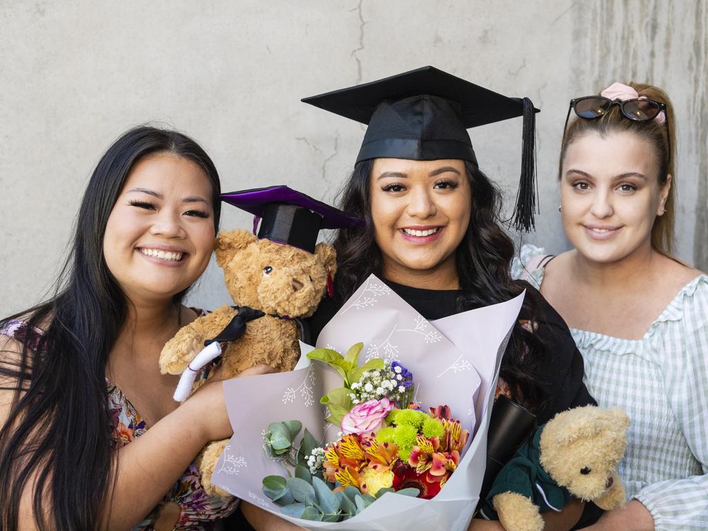 Bachelor of Paramedicine graduate Katherine Rivera with friends Cathy Nguyen (left) and Laura Sharp at the UniSQ graduation ceremony at Empire Theatres, Wednesday, December 14, 2022.