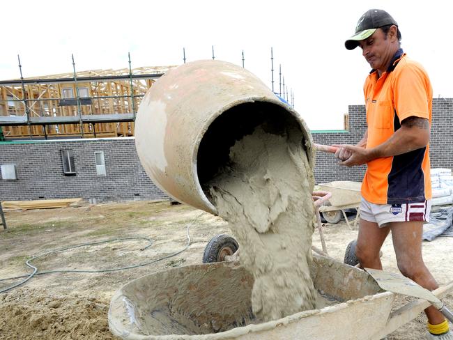 A builder mixes mortar for a new home. (AAP Image/Alan Porritt)