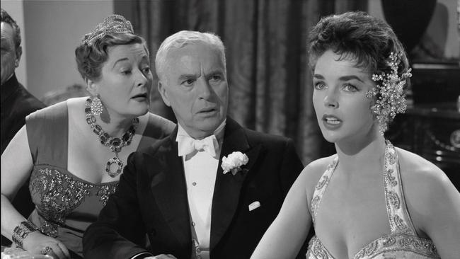 Dawn Addams, Charles Chaplin and Maxine Audley in a scene from King in New York, 1958