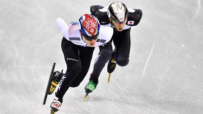 Japan's Kei Saito, right, during the 1500m short track speed skating event. Picture: AFP