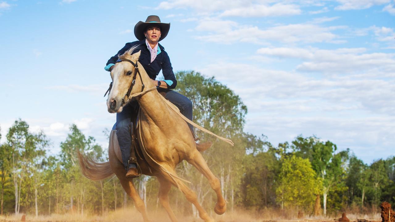 Kate Everett working her horse Teemak Touch of Mink at home on the family property outside Katherine. Picture: Lachie Millard