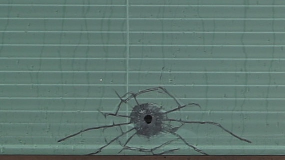 Bullets were fired at an Auburn Road building with one bullet passing through the bottom of a second story window. Picture: John Grainger