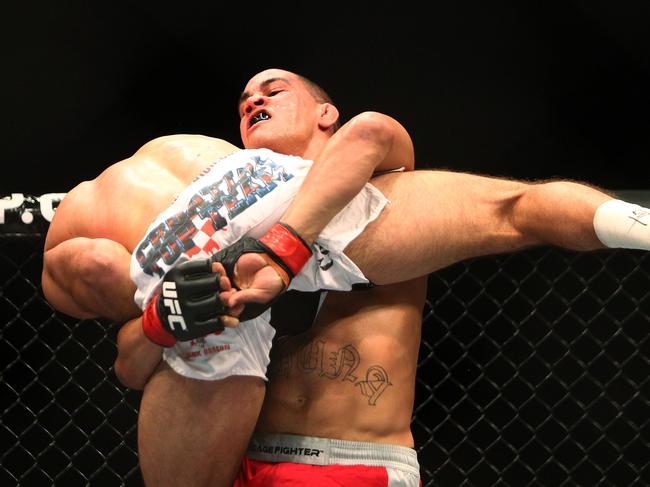 Te Huna lands a takedown despite having a badly broken left arm. Picture: Mark Nolan/Zuffa/Getty Images