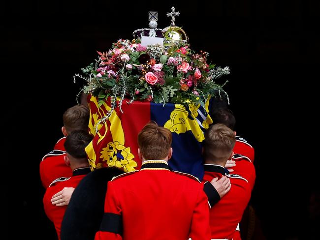 all bearers carry the coffin of Queen Elizabeth II with the Imperial State Crown resting on top into St. George's Chapel in Windsor, England. Picture: Getty Images