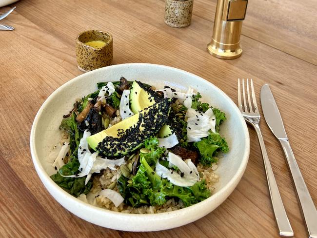 Leoht's Brown rice and quinoa bowl, which is topped with sauteed seasonal greens, mushrooms, a wedge of avocado, seeds and a tasty tahini dressing. Picture: Supplied.