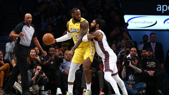 LeBron James and Kyrie Irving are rivals after winning a championship together in Cleveland. (Photo by Mike Stobe/Getty Images)