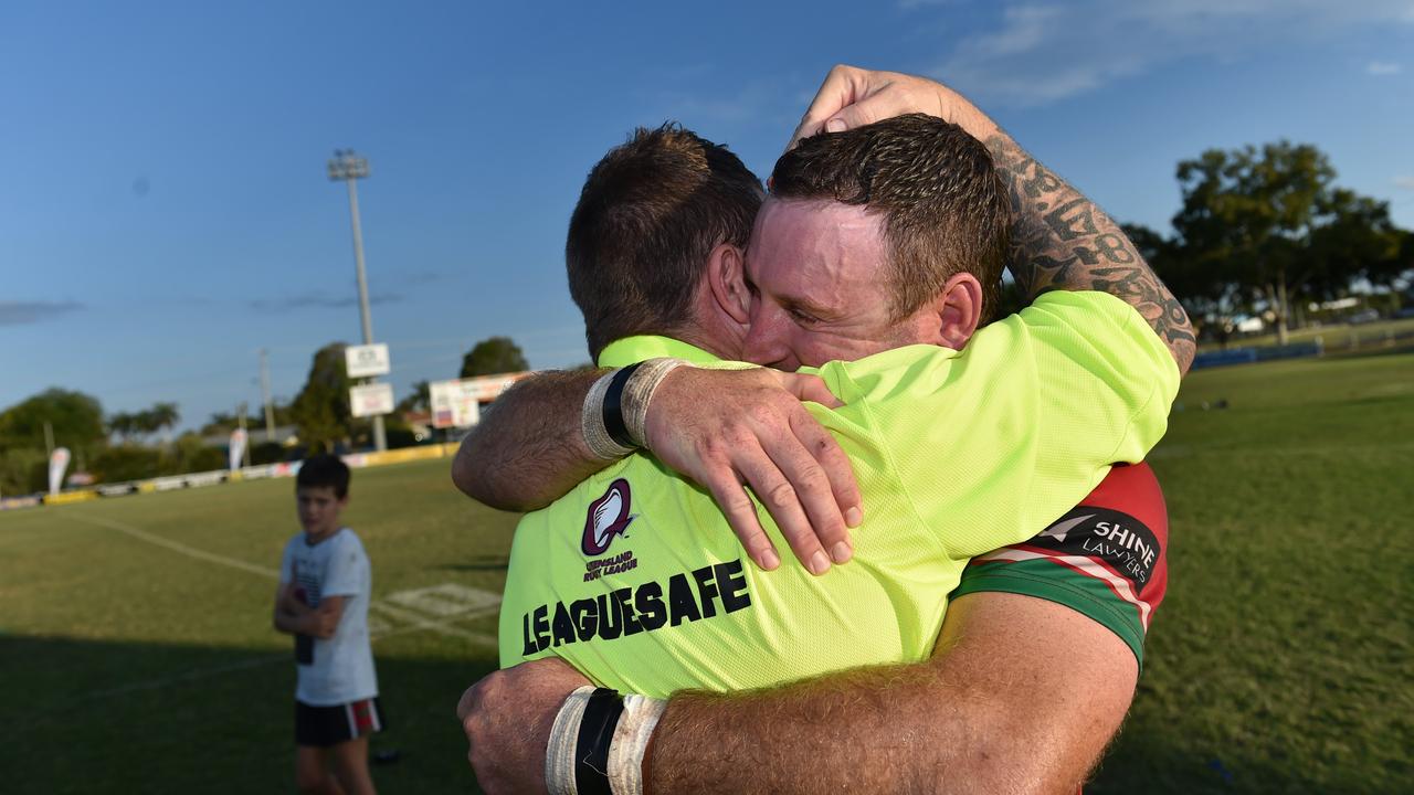 Seagulls veterans Guy Meredith and Adam Roderick embrace, both playing the side's 2001 title.