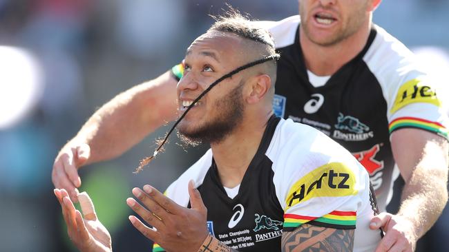 Tony Satini of the Panthers celebrates scoring a try.