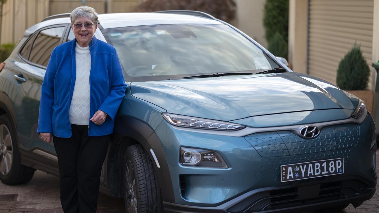 Carol Grout-Smith with her EV in Canberra. Picture: NCA NewsWire / Martin Ollman