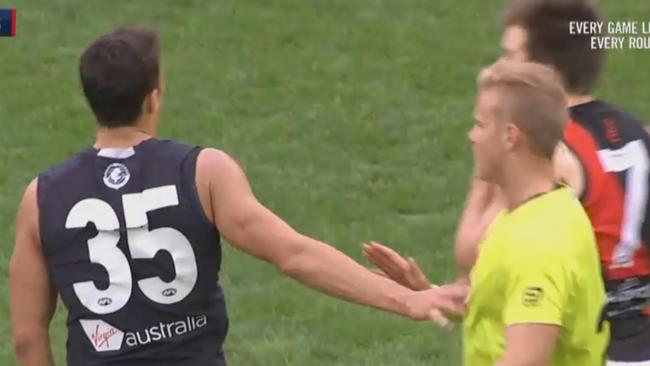 Carlton’s Ed Curnow touches umpire Nathan Williamson in the Round 8 game against Essendon. Picture: Fox Footy                        <a capiid="82e7a3eb762a10a6db6edbd6daae32cb" class="capi-video">John Worsfold: 'Great teams are player led'</a>