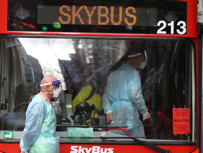 A SkyBus transports passengers to hotel quarantine. Picture: David Crosling