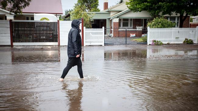 Some were forced to move through floodwaters despite warnings. Picture: NCA NewsWire / Emma Brasier