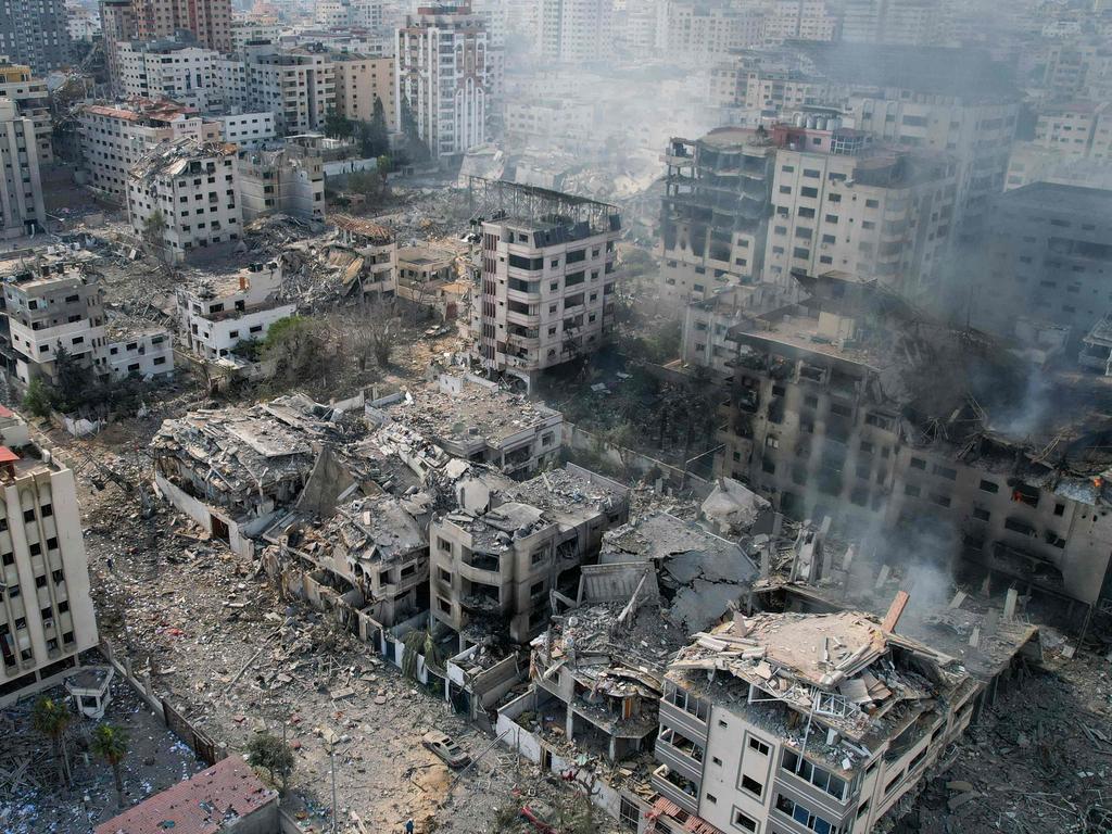 TOPSHOT - This aerial photo show heavily damaged buildings following Israeli airstrikes in Gaza City on October 10, 2023. Israel pounded Hamas targets in Gaza on October 10 and said the bodies of 1,500 Islamist militants were found in southern towns recaptured by the army in gruelling battles near the Palestinian enclave. (Photo by BELAL AL SABBAGH / AFP)