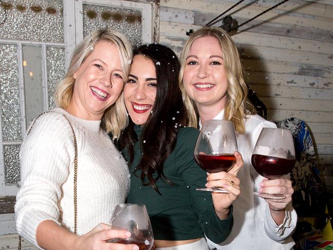 Chloe Hubbard, Danielle Bell-Thayer and Sophie Lancaster at The Collective Palm Beach Christmas in July event last year.