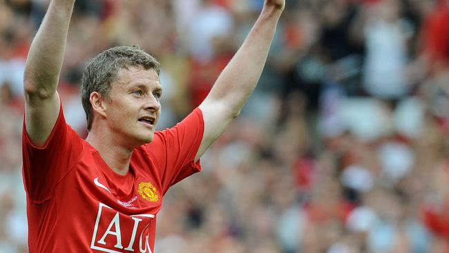 (FILES) In this file photo taken on August 02, 2008 Ole Gunnar Solskjaer of Manchester United waves to the fans at the final whistle after his testimonial football match between Manchester United and Espanyol at Old Trafford, in Manchester, north-west England. - Ole Gunnar Solskjaer was on December 19, 2018, named as Manchester United's caretaker manager until the end of the 2018/19 season following the sacking of Jose Mourinho. The former United striker will take charge of the first team with immediate effect and will remain in place while the club looks for a new full-time manager. (Photo by Andrew YATES / AFP) / RESTRICTED TO EDITORIAL USE. No use with unauthorized audio, video, data, fixture lists, club/league logos or 'live' services. Online in-match use limited to 75 images, no video emulation. No use in betting, games or single club/league/player publications. /