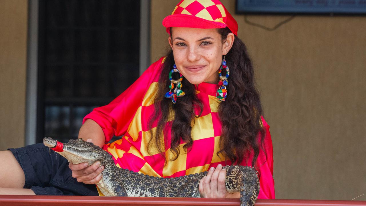 Croc racing at the Berry Springs Tavern for Melbourne Cup Day: Bartender and ‘jockey’ Gypsy Cass with one of the competing crocs. Picture: GLENN CAMPBELL