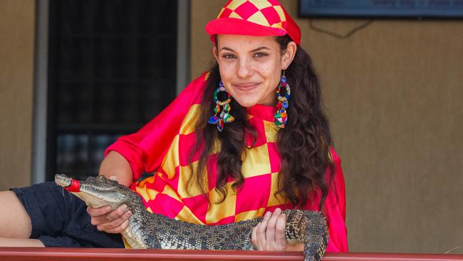 Croc racing at the Berry Springs Tavern for Melbourne Cup Day: Bartender and ‘jockey’ Gypsy Cass with one of the competing crocs. Picture: GLENN CAMPBELL