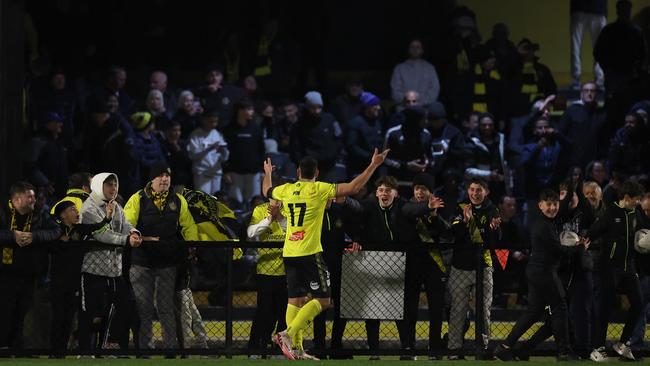 Josh Pin celebrates his second goal with the Heidelberg United faithful.