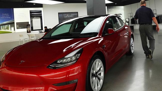 Can Tesla take on the likes of Apple within four years? Pictue: AFP