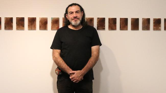 Khaled Sabsabi with his works at Mosman Art Gallery.