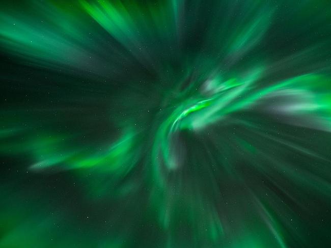 Corona ... A Northern Light corona outburst taken directly beneath the vibrant emerald green whirlpool swirling in the sky in Sommarøya near Tromsø, Norway, on 15 March 2015. Picture: Bernt Olsen, Insight Astronomy Photographer of the Year 2016 Aurorae Highly Commended
