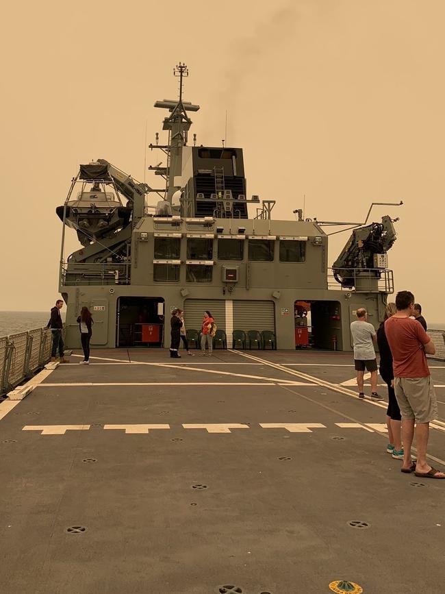 Mallacoota evacuees board the MV Sycamore, a training vessel that has left the town.