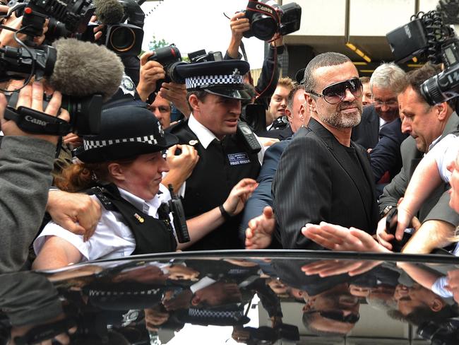Michael outside Highbury Corner Magistrates Court in London in 2010 after he was charged after crashing his car in to shop. Picture: Ben Stansall/AFP