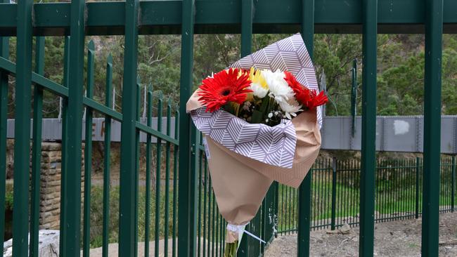 Flowers at the scene of where the body of Massimo Chesini was found near the old Gorge Weir Aqueduct on Gorge Road, Athelstone on Thursday 17th February 2022 – Picture: Michael Marschall