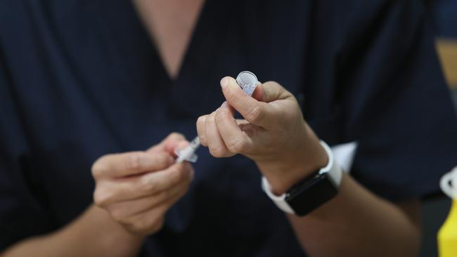 A nurse prepares a COVID-19 vaccine at the Rembrandt Aged Care facility at Oaklands Park, southern Adelaide. Picture: Emma Brasier