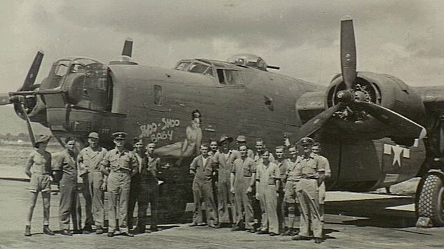 Townsville, Qld. 1944-04-11. US Fifth air force Service Command. A mixed party of RAAF and US technicians at Garbutt airfield after a successful flight of the B-24 Liberator bomber