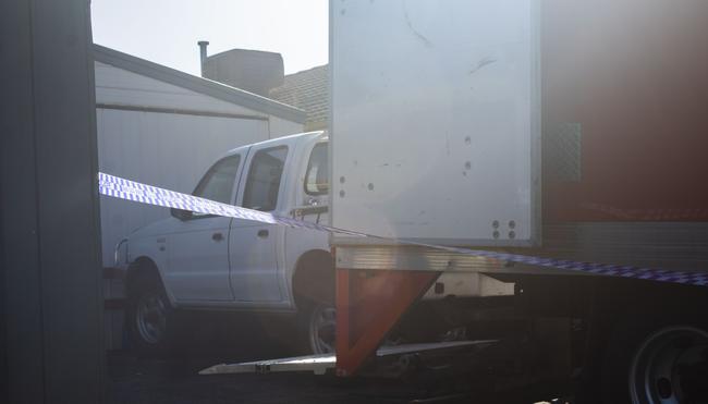 A plethora of car parts were seized and loaded into a red Avis truck when police raided an alleged chop shop in Carrum Downs.