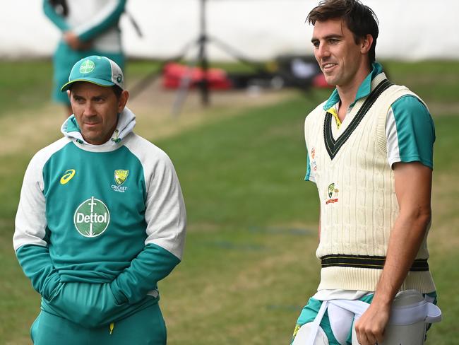 HOBART, AUSTRALIA - JANUARY 12: Pat Cummins Captain of Australia chats with Justin Langer Head Coach of Australia during an Australian Ashes squad nets session at Blundstone Arena on January 12, 2022 in Hobart, Australia. (Photo by Steve Bell/Getty Images)