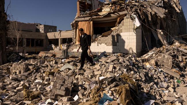 A man walks in front of a damaged school in the city of Zhytomyr, northern Ukraine, earlier this month. Picture: AFP