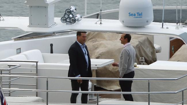 Karl Stefanovic (left) chats with Member for Wentworth Dave Sharma on board super yacht “Mohasuwei” on Sydney Harbour.