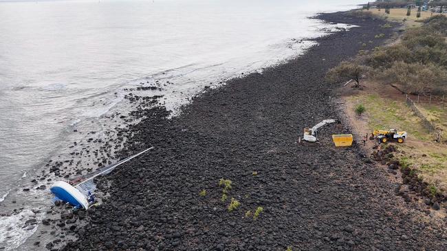 An aerial view of the 12m yacht on the rocks.