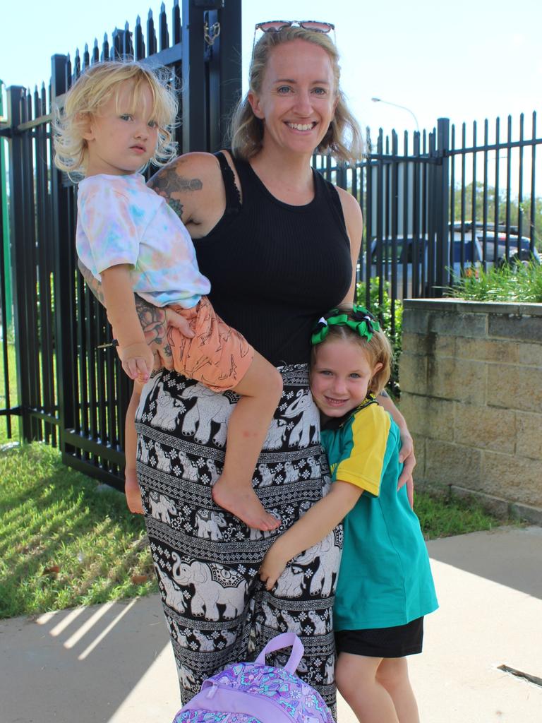 Mikayla Michel clung close to her Mum Lisa as she arrived for her first day of school at Moore Park Beach State School together with brother Maxwell.