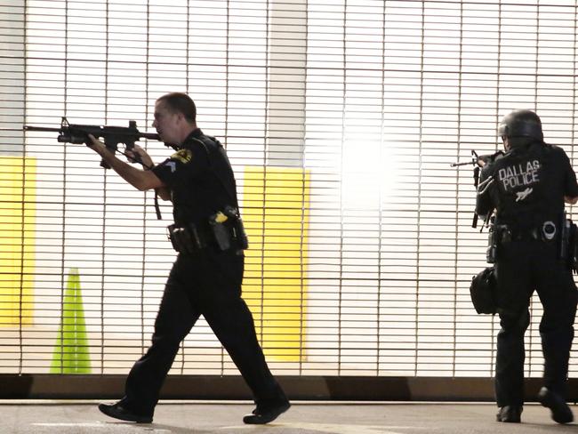 Dallas police respond after shots were fired during the protest in what Obama called a “despicable” attack. Picture: Maria R. Olivas/The Dallas Morning News via AP.