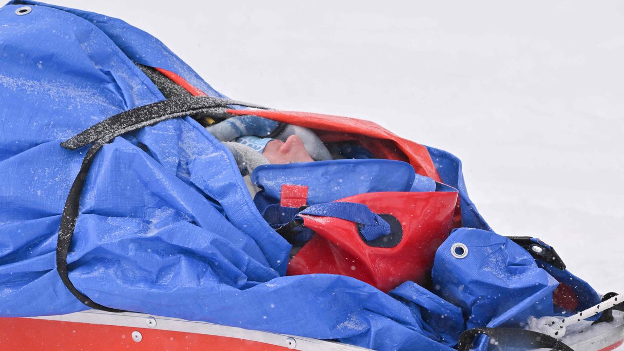 Australia's Belle Brockhoff is evacuated on a stretcher. Photo by Ben STANSALL / AFP.