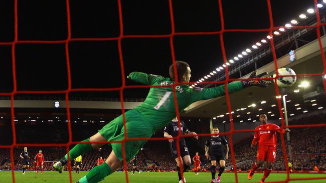 Daniel Sturridge of Liverpool scores their second goal past Thomas Heaton.