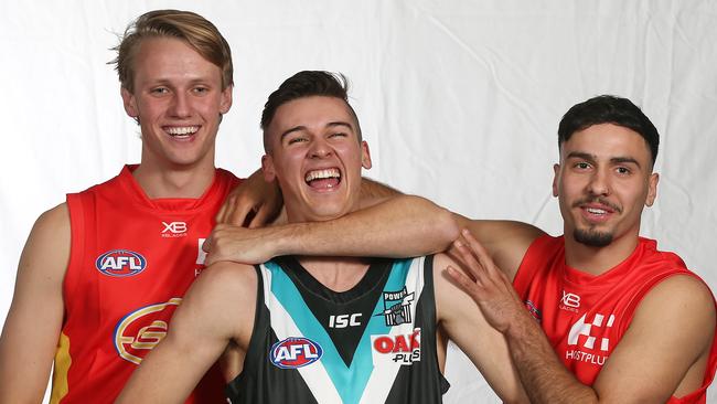 Gold Coast’s Jack Lukosius and Izak Rankine with Port’s Connor Rozee. Picture: Michael Klein