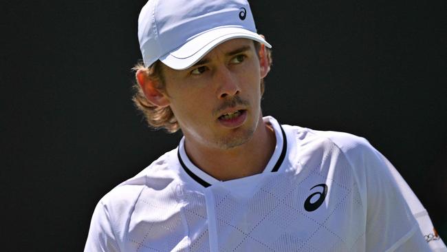 Australia's Alex De Minaur reacts after winning a point against Spain's Jaume Munar during their men's second round singles tennis match on the fourth day of the 2024 Wimbledon Championships at The All England Lawn Tennis and Croquet Club in Wimbledon, southwest London, on July 4, 2024. (Photo by Glyn KIRK / AFP) / RESTRICTED TO EDITORIAL USE