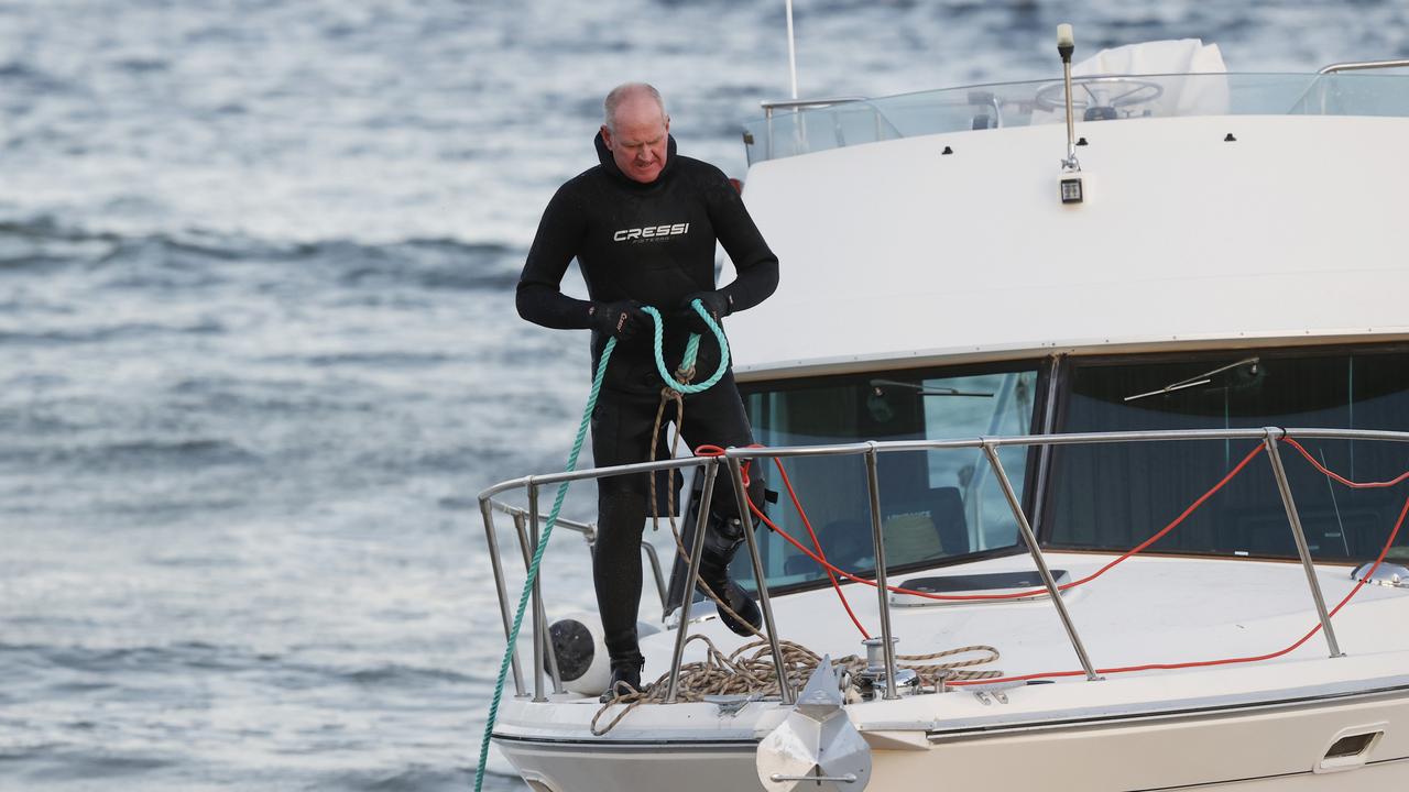 A police diver boards the boat on Thursday morning. Picture: NewsWire / Nikki Davis-Jones