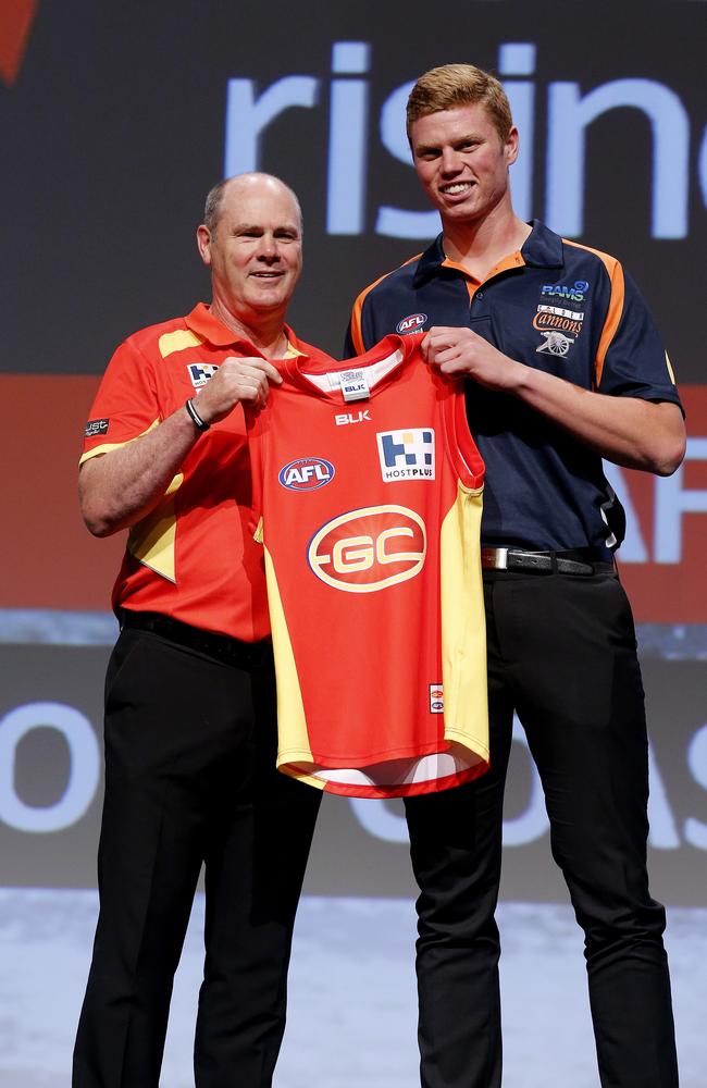 Gold Coast coach Rodney Eade presented Peter Wright with a Suns jumper. Picture: Jerad Williams